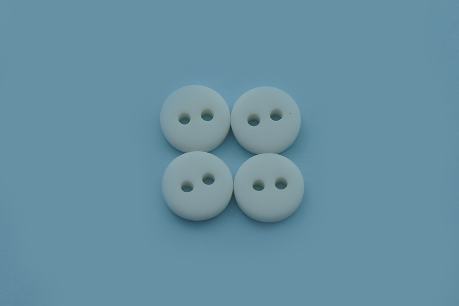 Гудзик 9 мм Mertbutton 2 отвори однотонний білий