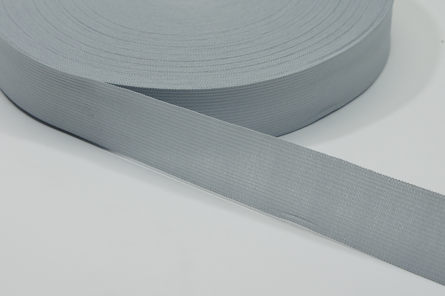 Тасьма 23 мм в'язана сірий світлий