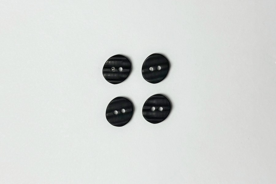 Гудзик 15 мм 2 отвори фактурний