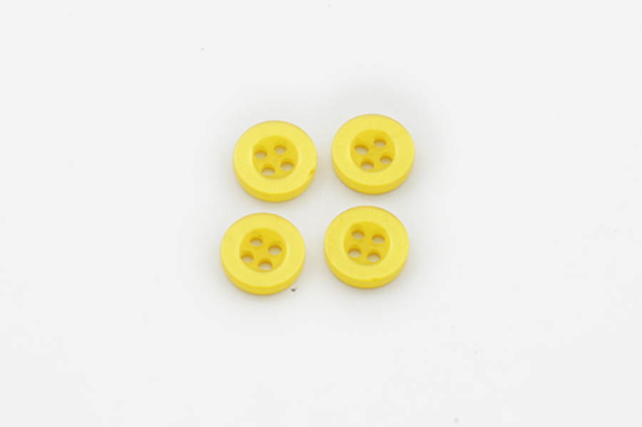 Гудзик 9 мм Mertbutton 4 отвори перламутр жовтий