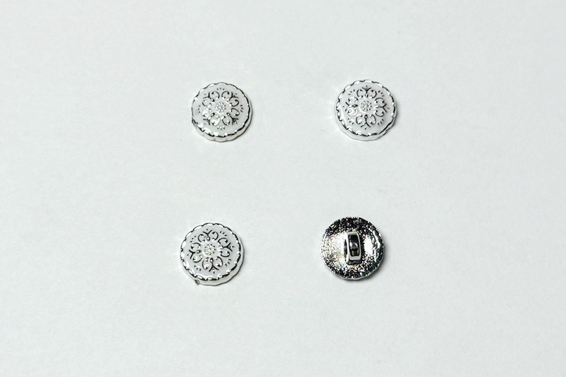 Гудзик на ніжці 12 мм Mertbutton металізований білий BR-652-20-999/silver